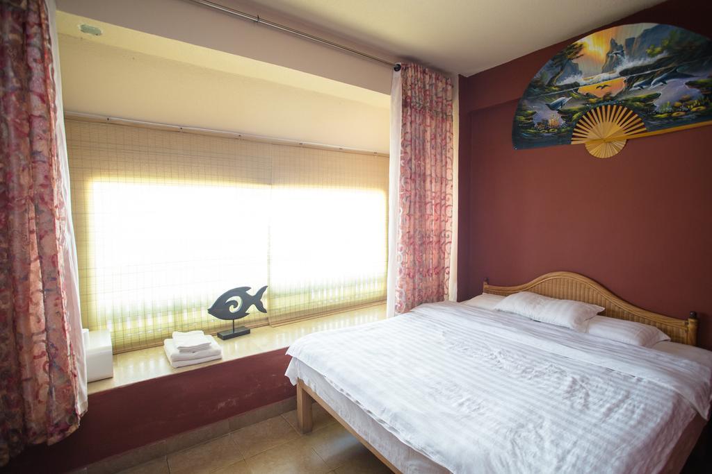G.T. Guest House Garapan Oda fotoğraf
