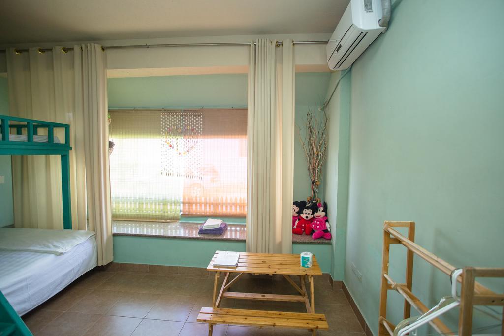 G.T. Guest House Garapan Oda fotoğraf