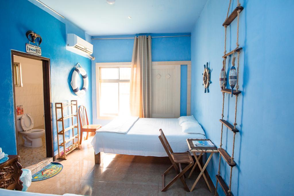 G.T. Guest House Garapan Oda fotoğraf